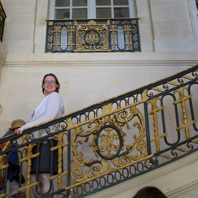 Angela on some stairs in the Petit-Trainon at Versailles